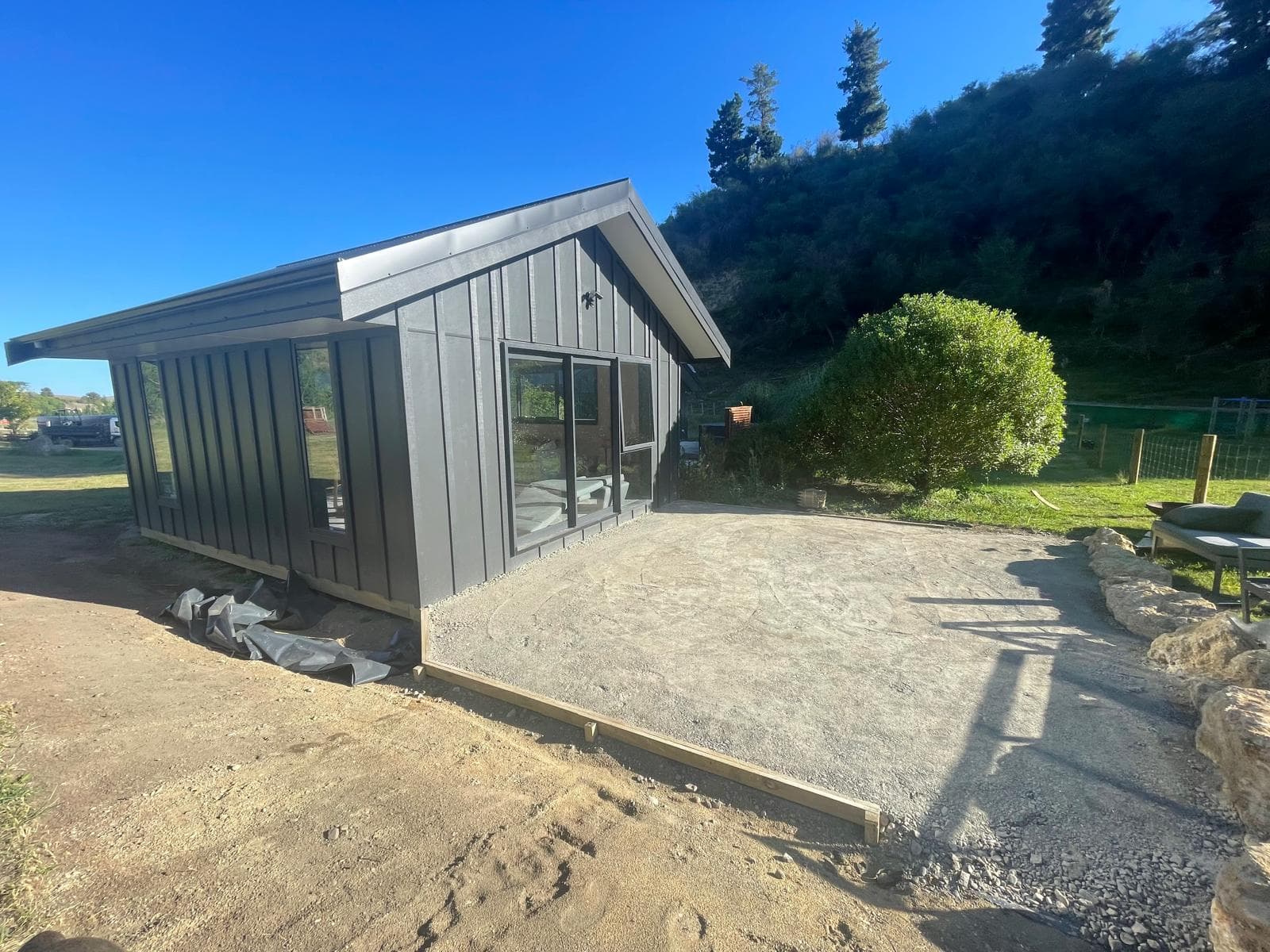 Gravel patio installation for cabin outdoor area